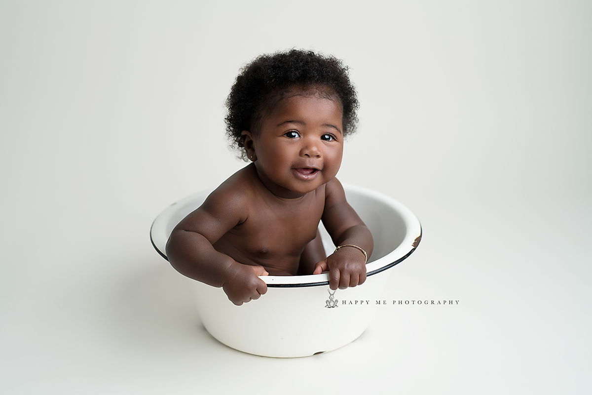 baby photography showing baby girl in a white bowl